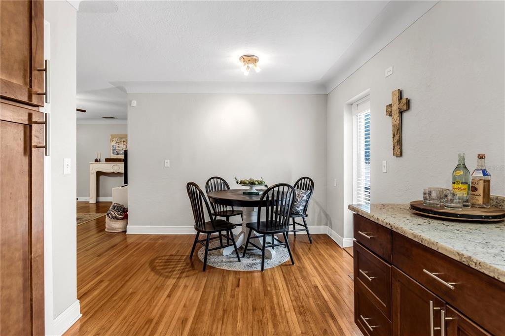 2425 36th Avenue North St. Petersburg, FL 33713 - Photo 12 of 32 a view of a dining room with furniture and wooden floor
