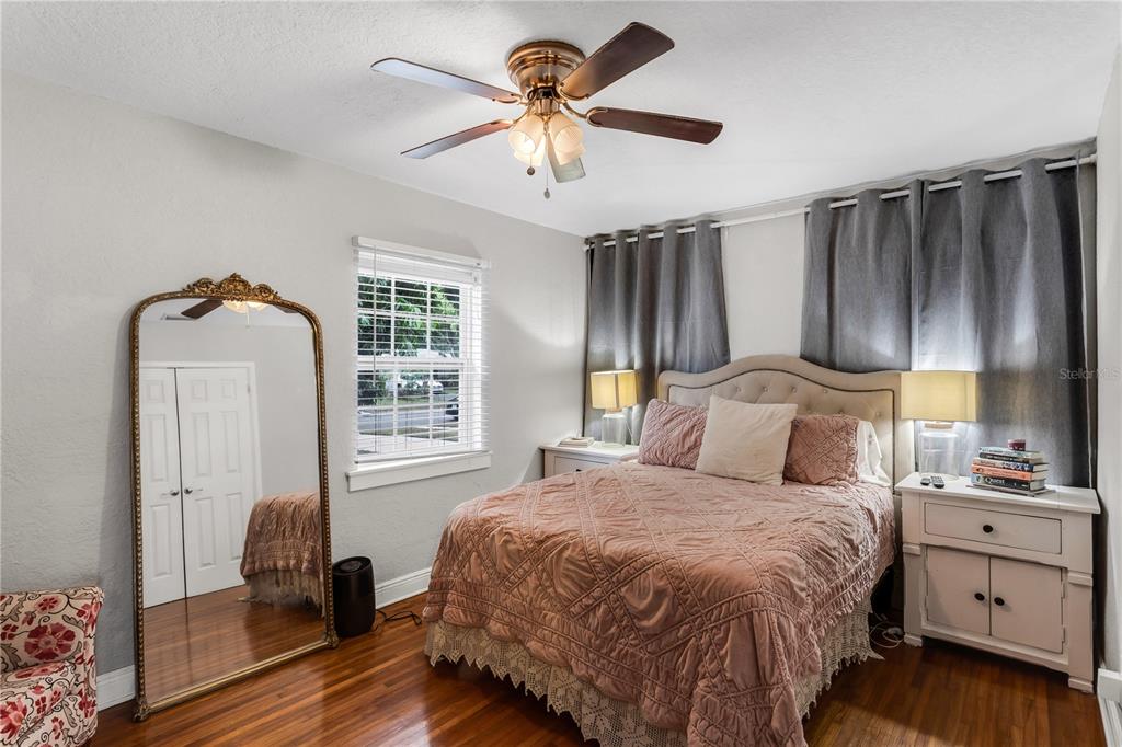 2425 36th Avenue North St. Petersburg, FL 33713 - Photo 18 of 32 a bedroom with a bed and a chandelier