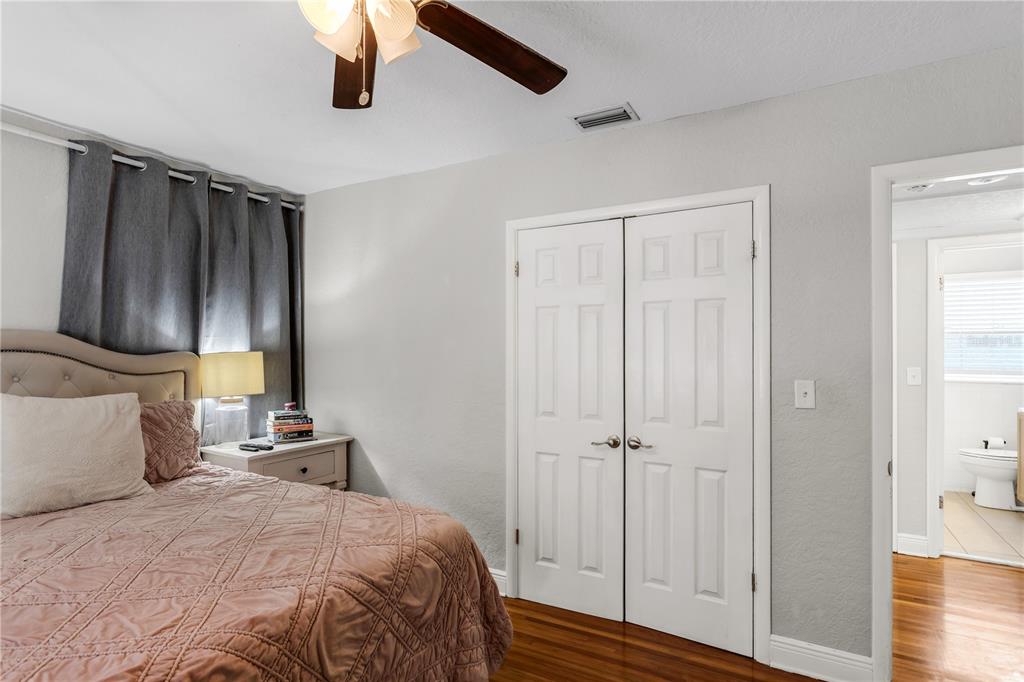 2425 36th Avenue North St. Petersburg, FL 33713 - Photo 19 of 32 a bedroom with a bed and a mirror