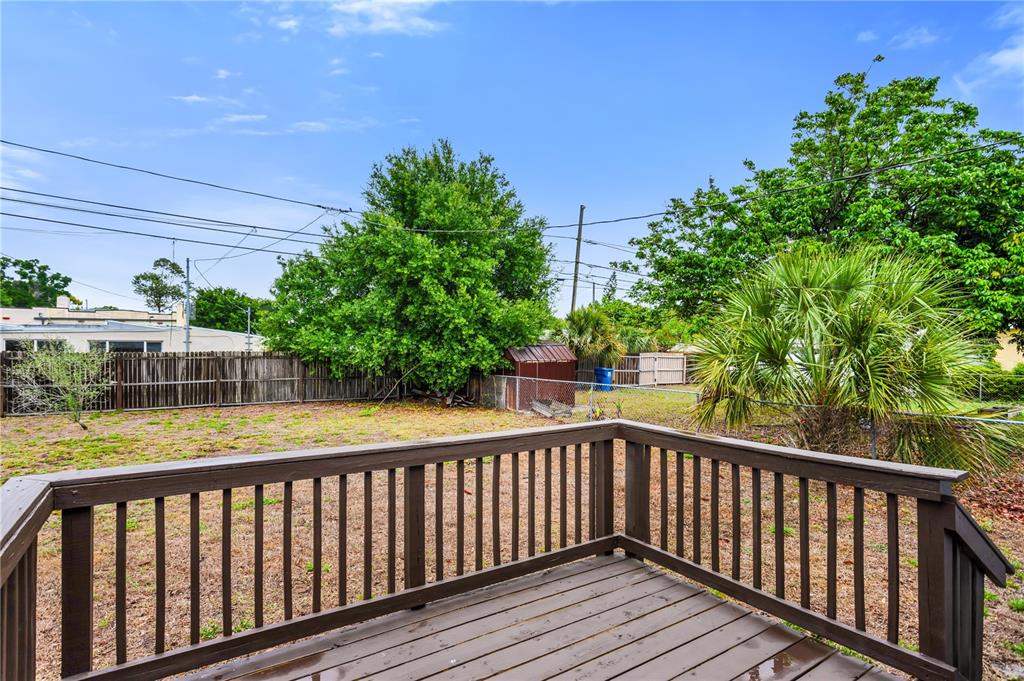 2425 36th Avenue North St. Petersburg, FL 33713 - Photo 26 of 32 a balcony with wooden floor and yard in the back