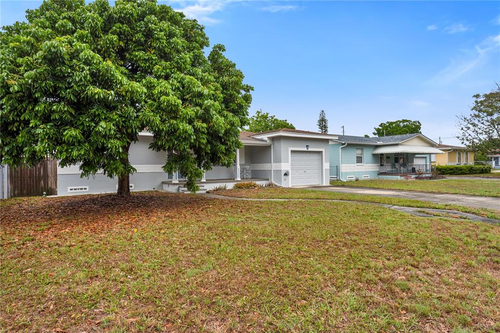 2425 36th Avenue North St. Petersburg, FL 33713 - Photo 3 of 32 a front view of a house with a yard