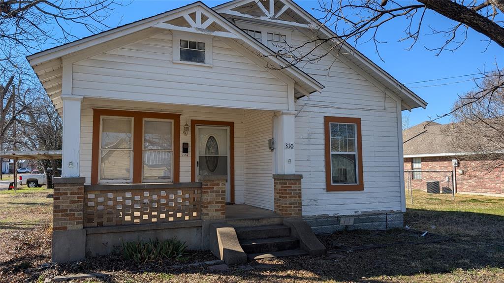 310 South Davis Street West, TX 76691 - Photo 1 of 1 a front view of a house with a yard