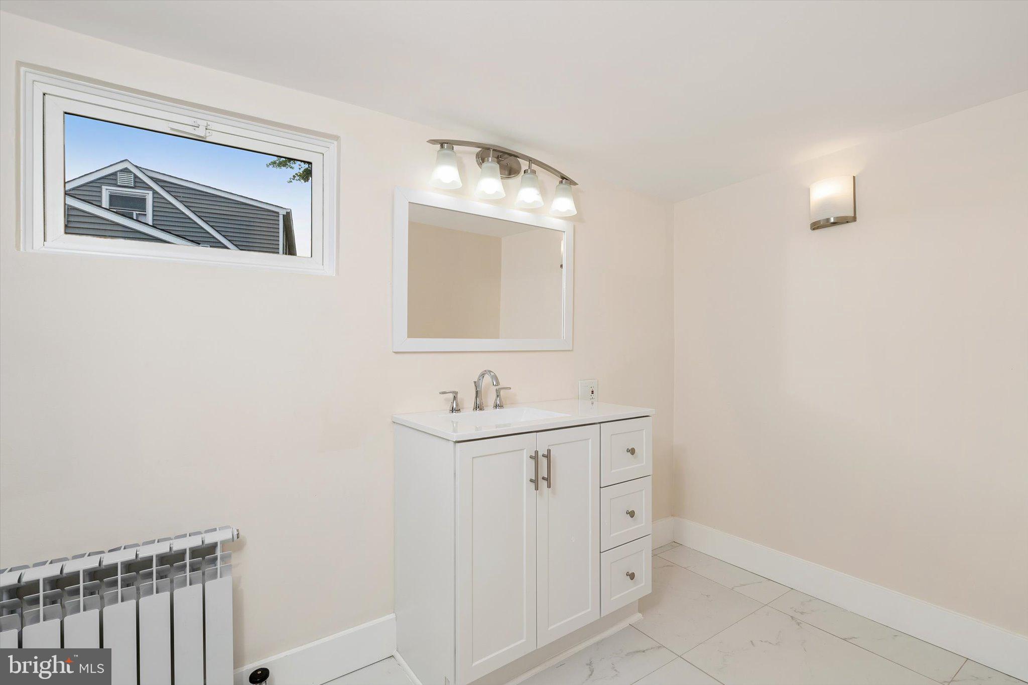 542 Mercerville-Edinburg Road Trenton, NJ 08619 - Photo 15 of 31 a bathroom with a sink and a mirror