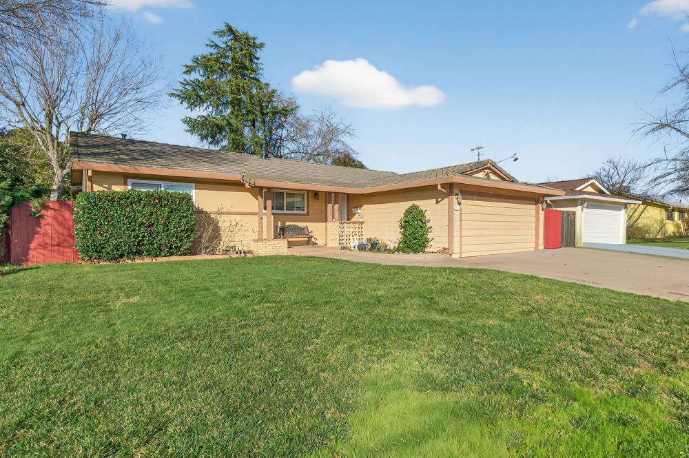 10649 Campana Way Rancho Cordova, CA 95670 - Photo 1 of 40 a front view of a house with a yard and garage