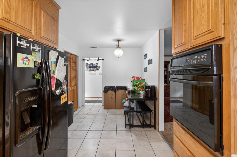 10649 Campana Way Rancho Cordova, CA 95670 - Photo 13 of 40 a kitchen with stainless steel appliances granite countertop a refrigerator and a stove top oven