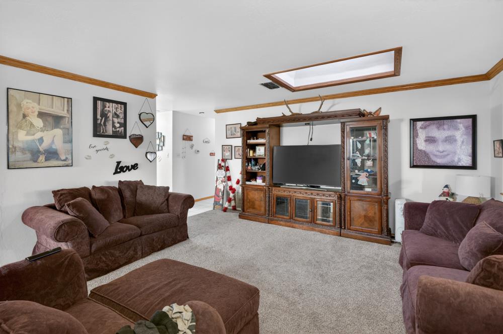 10649 Campana Way Rancho Cordova, CA 95670 - Photo 14 of 40 a living room with furniture and a flat screen tv