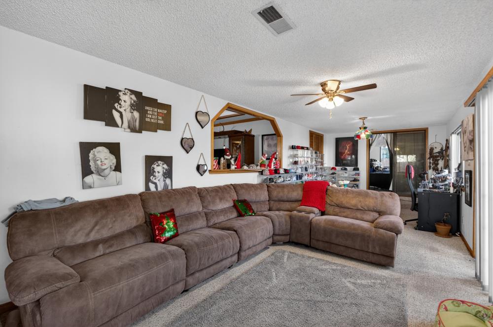 10649 Campana Way Rancho Cordova, CA 95670 - Photo 16 of 40 a living room with furniture kitchen view and a chandelier