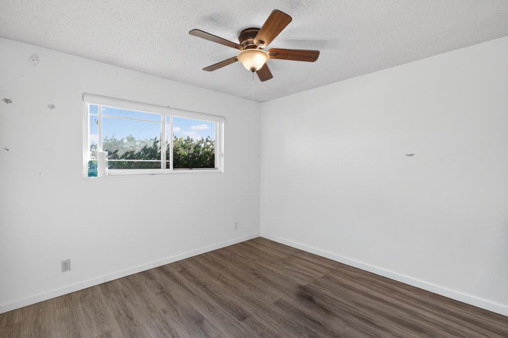 10649 Campana Way Rancho Cordova, CA 95670 - Photo 23 of 40 a view of an empty room with wooden floor