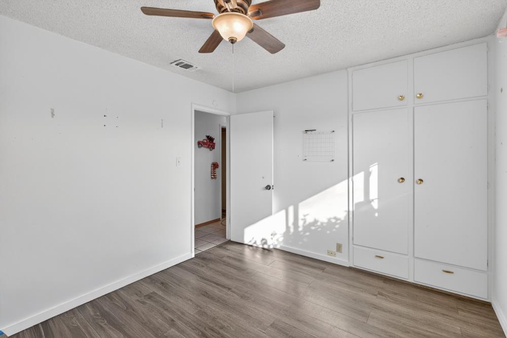 10649 Campana Way Rancho Cordova, CA 95670 - Photo 24 of 40 a view of an empty room with wooden floor