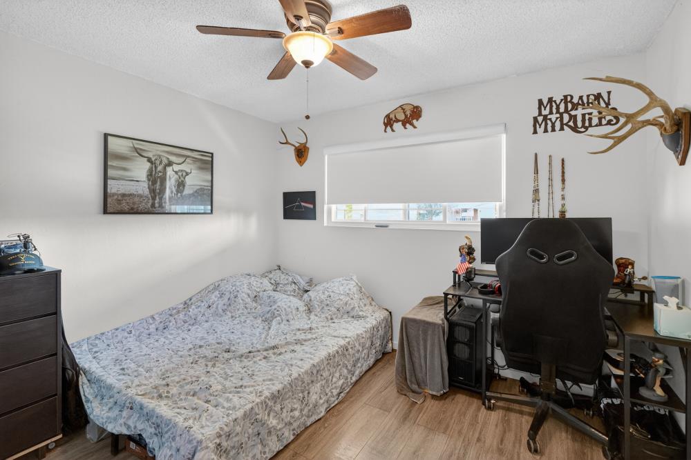 10649 Campana Way Rancho Cordova, CA 95670 - Photo 28 of 40 a bedroom with a bed and wooden floor