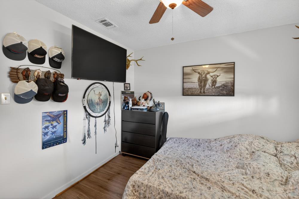 10649 Campana Way Rancho Cordova, CA 95670 - Photo 29 of 40 a bedroom with a bed and a flat screen tv