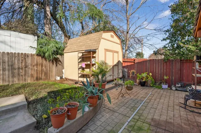 a view of a backyard with sitting area