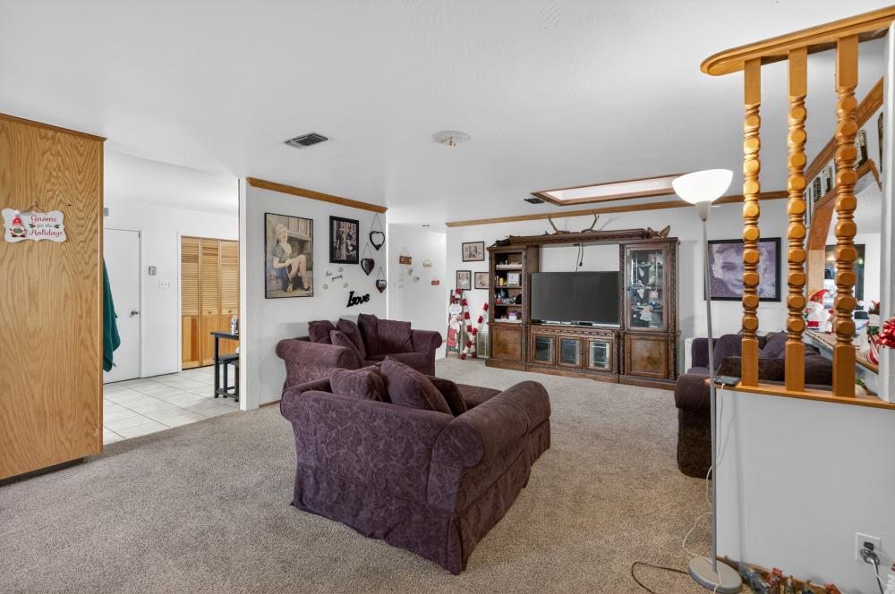 10649 Campana Way Rancho Cordova, CA 95670 - Photo 7 of 40 a living room with furniture and a flat screen tv