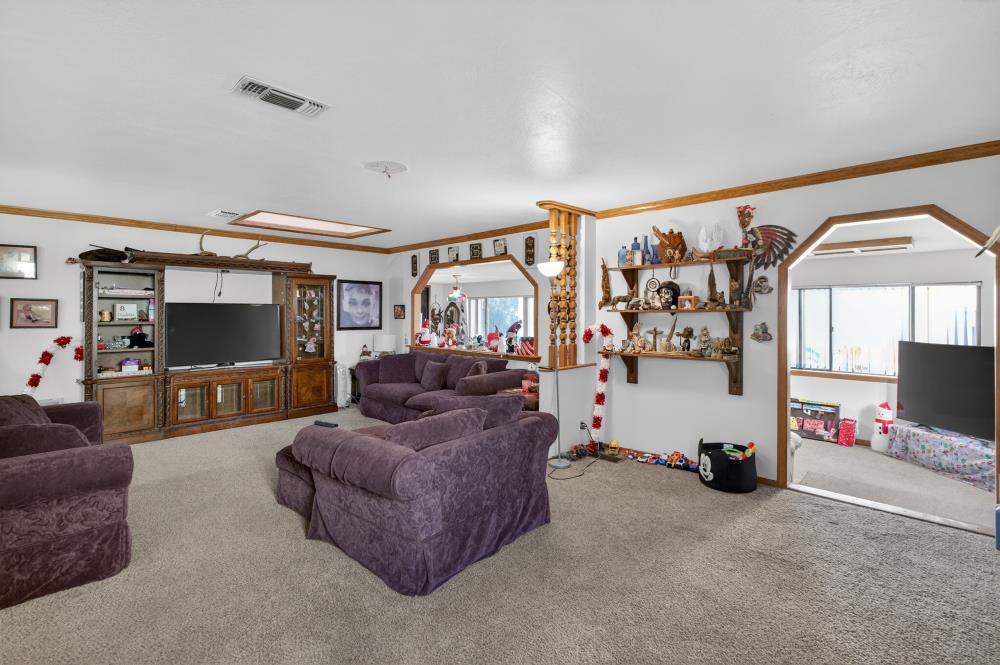 10649 Campana Way Rancho Cordova, CA 95670 - Photo 8 of 40 a living room with furniture and a flat screen tv