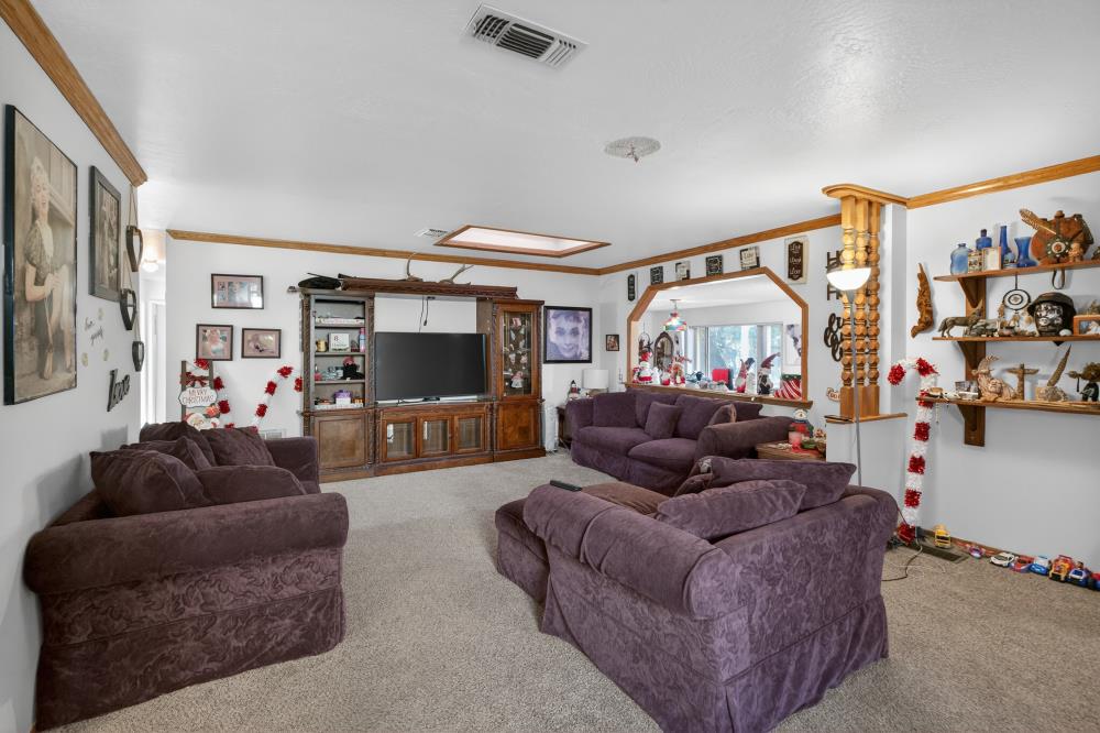 10649 Campana Way Rancho Cordova, CA 95670 - Photo 9 of 40 a living room with furniture and a flat screen tv