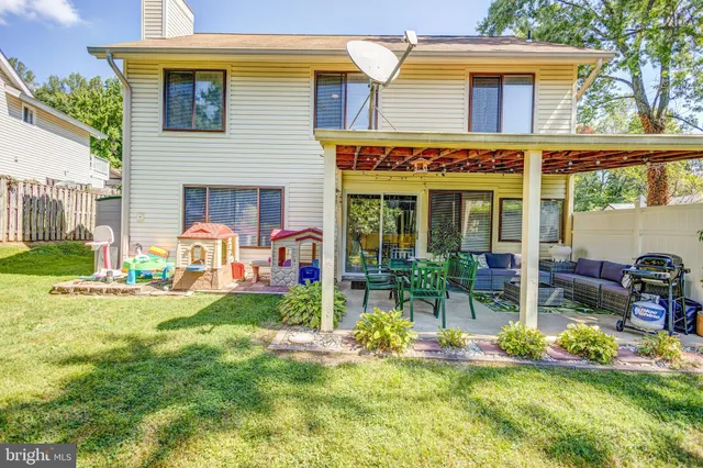a front view of house with yard and outdoor seating