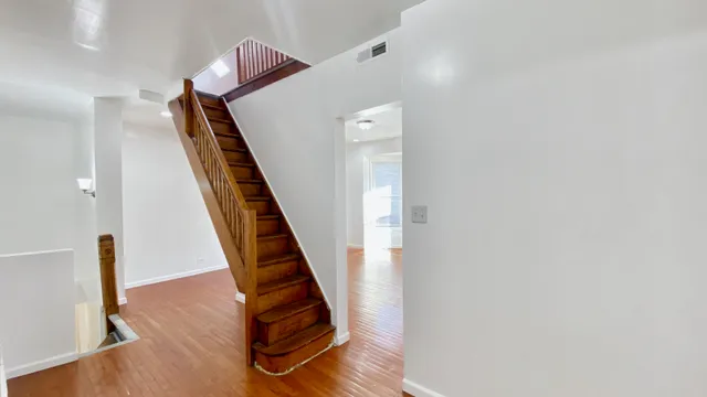 a view of entryway with wooden floor