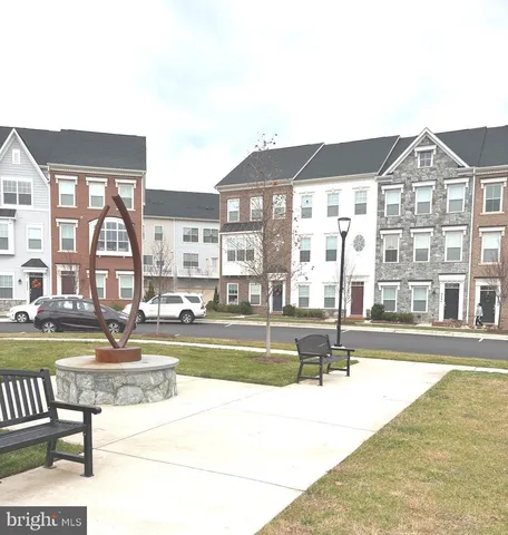 a view of swimming pool with outdoor seating