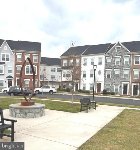 a view of a swimming pool with outdoor seating