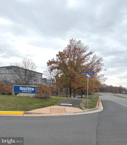 a view of a fountain in front of a house