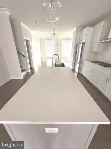 a large white bed in a white room