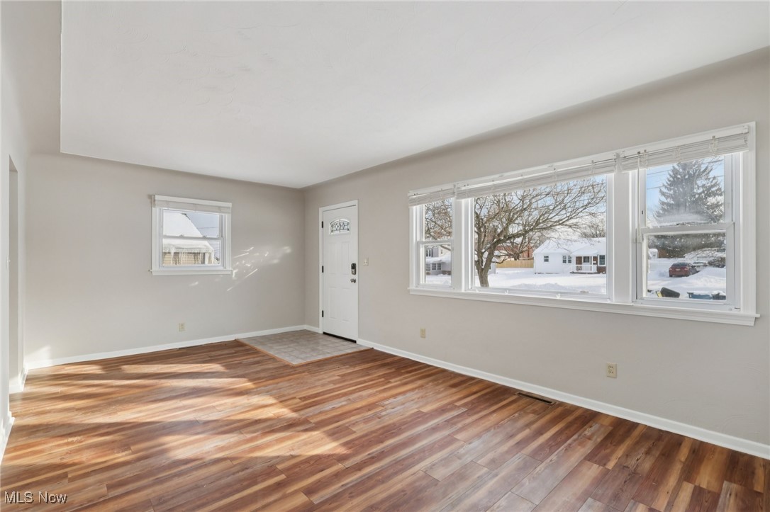 611 Wilson Street Struthers, OH 44471 - Photo 6 of 44 Foyer entrance featuring light wood-style flooring and baseboards