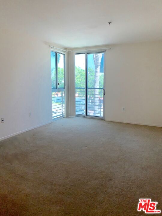 267 San Pedro Street, Unit 221 Los Angeles, CA 90012 - Photo 12 of 45 a view of an empty room with a window