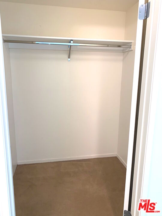 267 San Pedro Street, Unit 221 Los Angeles, CA 90012 - Photo 14 of 45 a view of small space with racks on the wall