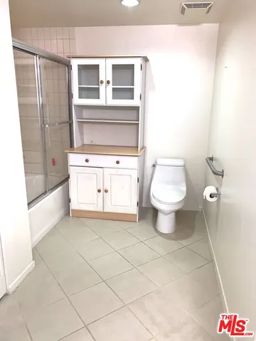 a bathroom with a vanity and a mirror