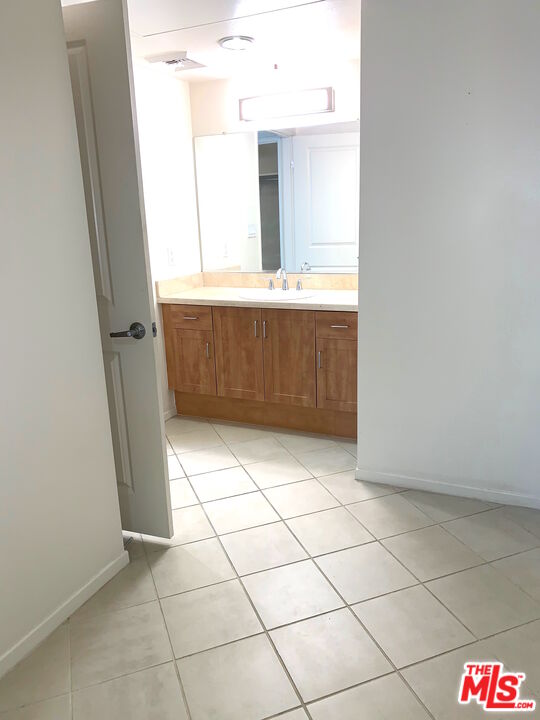 267 San Pedro Street, Unit 221 Los Angeles, CA 90012 - Photo 17 of 45 a bathroom with a vanity and a mirror