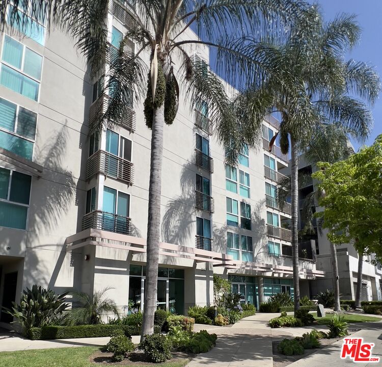 267 San Pedro Street, Unit 221 Los Angeles, CA 90012 - Photo 2 of 45 a front view of a multi story building with yard