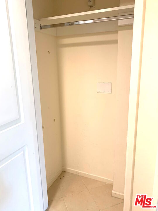 267 San Pedro Street, Unit 221 Los Angeles, CA 90012 - Photo 21 of 45 a bathroom with a glass shower door