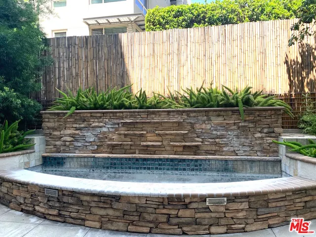 a large kitchen with a table and chairs