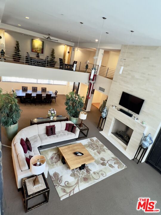 267 San Pedro Street, Unit 221 Los Angeles, CA 90012 - Photo 34 of 45 a living room with furniture and a flat screen tv