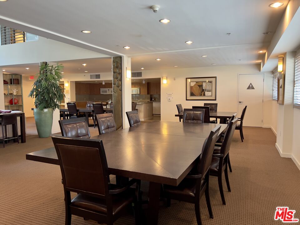 267 San Pedro Street, Unit 221 Los Angeles, CA 90012 - Photo 41 of 45 a view of a dining room with furniture and wooden floor