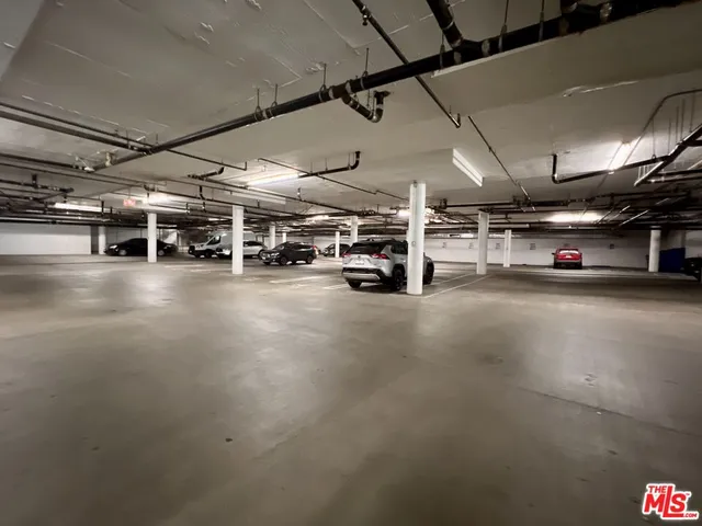 a view of parking garage with cars