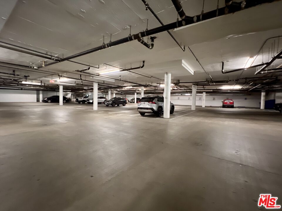 267 San Pedro Street, Unit 221 Los Angeles, CA 90012 - Photo 44 of 45 a view of a garage with cars