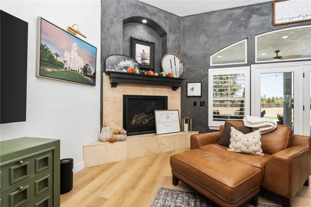 a living room with furniture and a fireplace