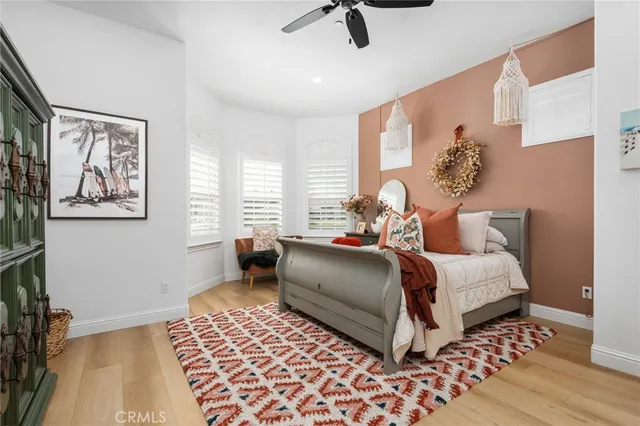 a bedroom with bed and a window