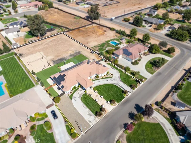 an aerial view of multiple houses with yard