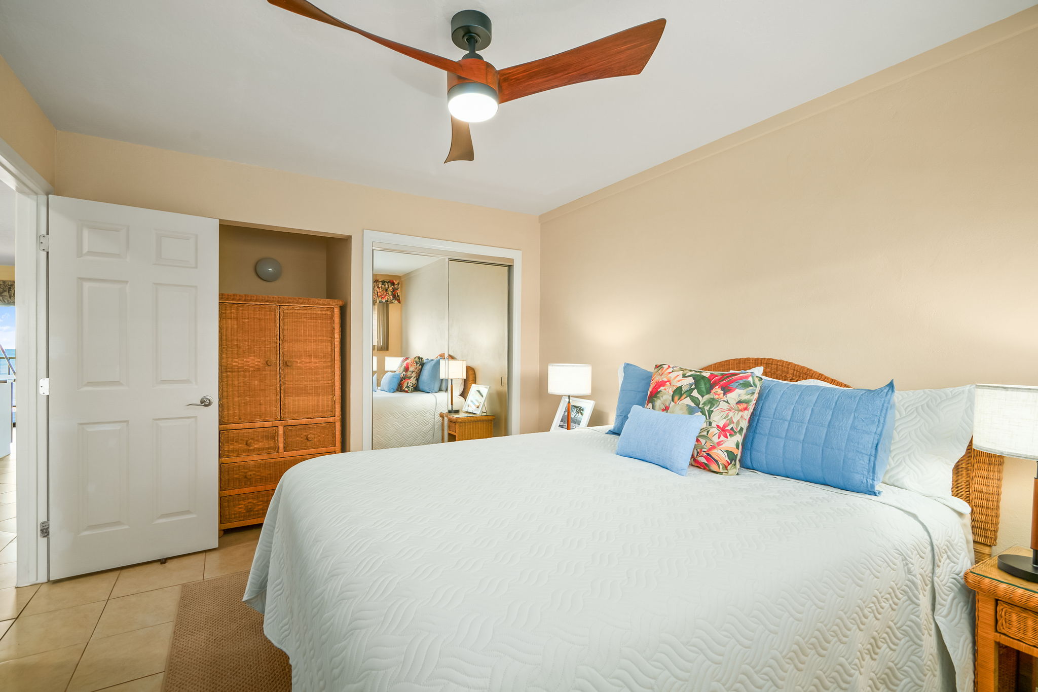 4451 Moana Road, Unit 309 Waimea, HI 96796 - Photo 15 of 21 a bedroom with a bed and a chandelier