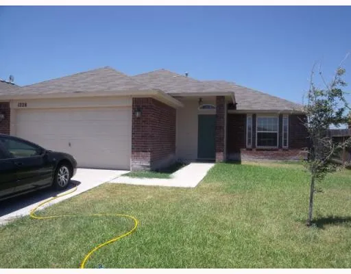 a house view with a garden space