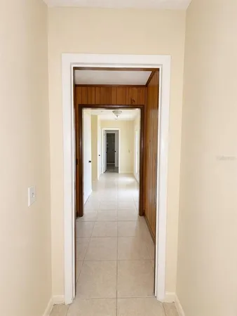 a view of a hallway with an entryway