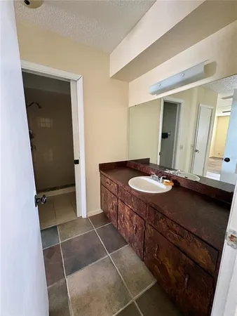 a bathroom with a sink a vanity and a mirror