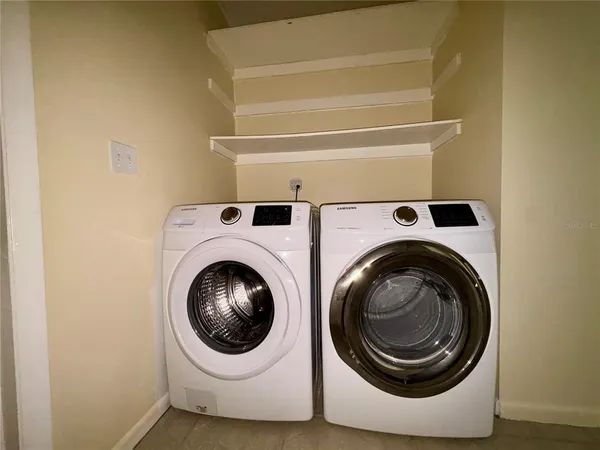 a utility room with dryer and washer