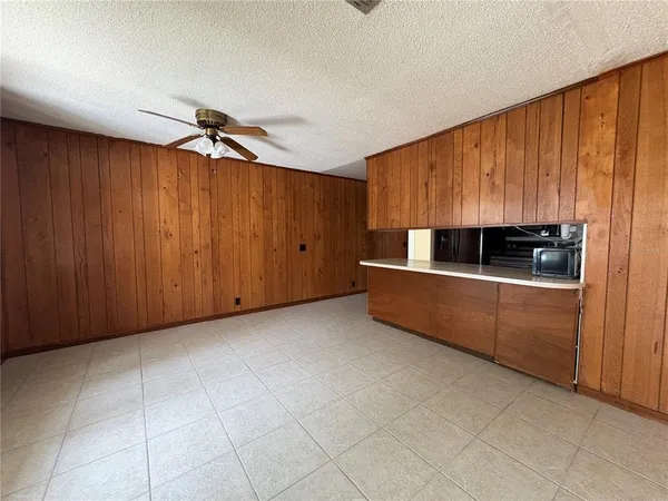 a view of kitchen with cabinets