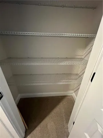 a bathroom with a toilet and a bathtub