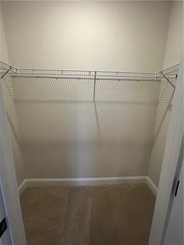 a white toilet and tub sitting next to a bathroom sink