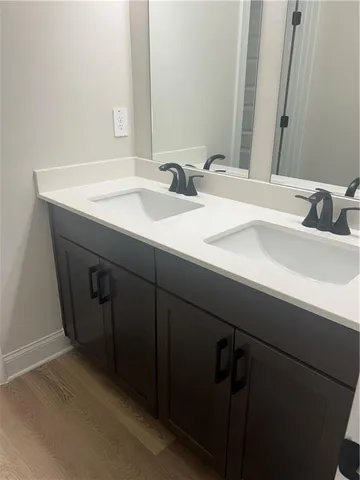 a metallic refrigerator freezer sitting in a kitchen
