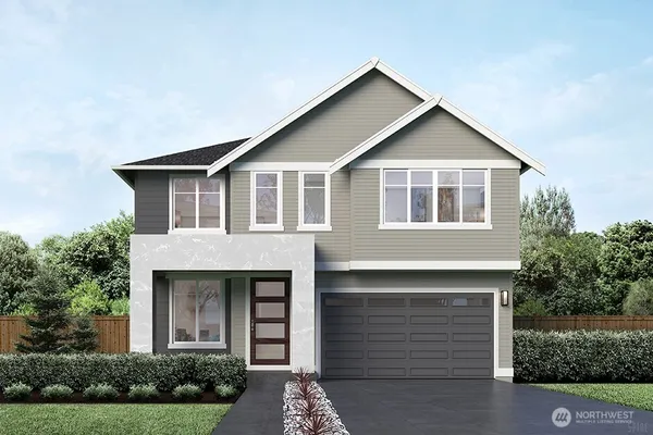 a front view of a house with garage
